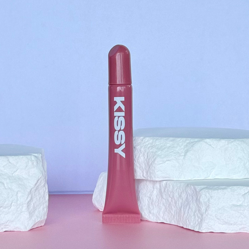 Open Kissy Gloss Red tube showing the red gloss applicator tip